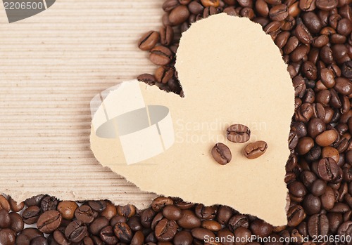 Image of coffee grains on paper the form of heart
