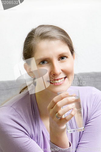 Image of Portrait of a young attractive woman smiling