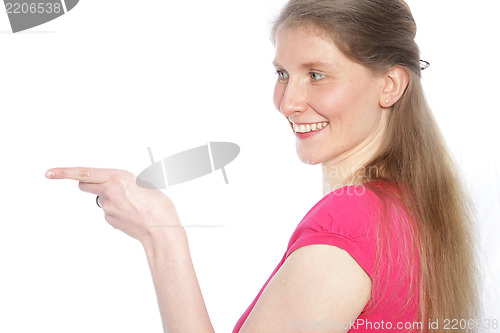 Image of Smiling woman pointing with her finger