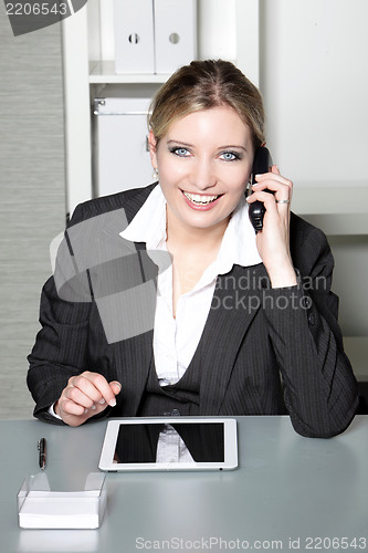 Image of Businesswoman taking a call on her mobile