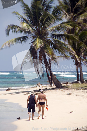 Image of man woman tourists walking  Sally Peaches Beach Big Corn Island 