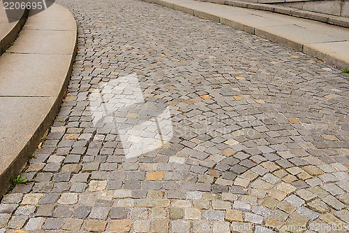 Image of A paved street with a curb under intense uphill