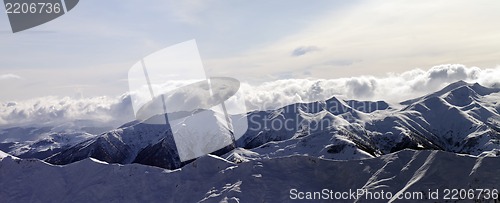 Image of Panorama of evening mountains in clouds