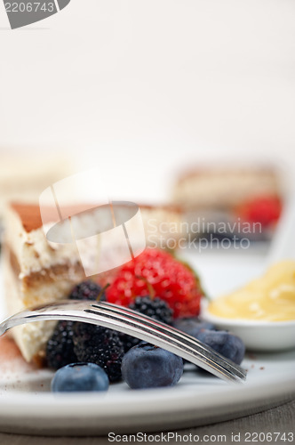 Image of tiramisu dessert with berries and cream