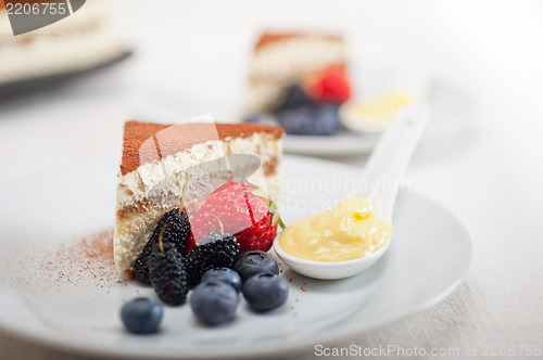 Image of tiramisu dessert with berries and cream