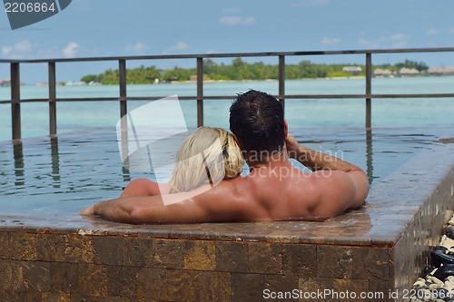 Image of happy young  couple at summer vacation have fun and relax