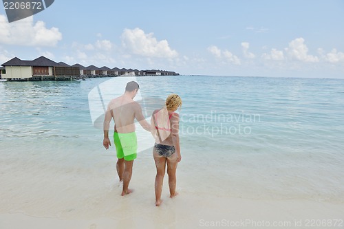 Image of happy young  couple at summer vacation have fun and relax