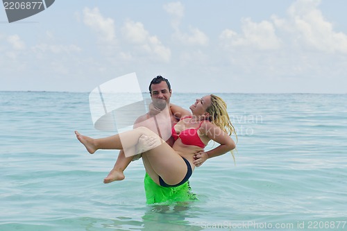 Image of happy young  couple at summer vacation have fun and relax