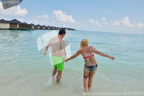 Image of happy young  couple at summer vacation have fun and relax