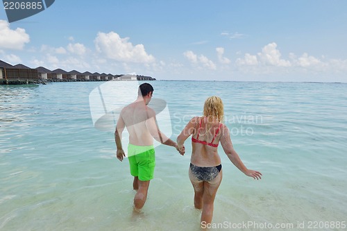 Image of happy young  couple at summer vacation have fun and relax