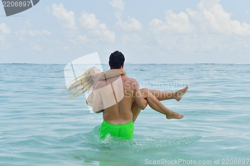 Image of happy young  couple at summer vacation have fun and relax