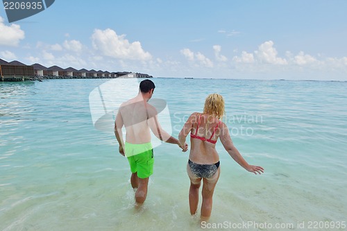 Image of happy young  couple at summer vacation have fun and relax