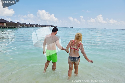 Image of happy young  couple at summer vacation have fun and relax