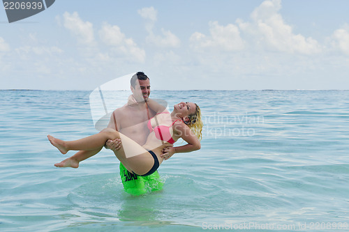 Image of happy young  couple at summer vacation have fun and relax