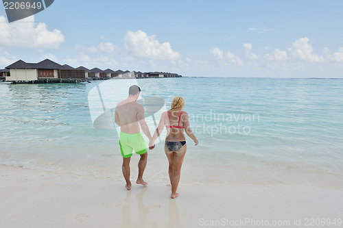 Image of happy young  couple at summer vacation have fun and relax
