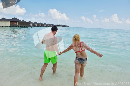 Image of happy young  couple at summer vacation have fun and relax