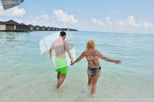 Image of happy young  couple at summer vacation have fun and relax