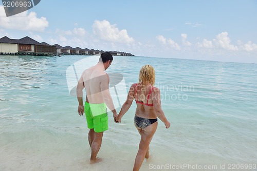 Image of happy young  couple at summer vacation have fun and relax