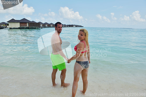 Image of happy young  couple at summer vacation have fun and relax