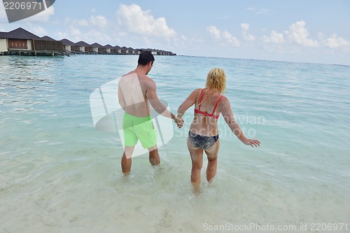 Image of happy young  couple at summer vacation have fun and relax