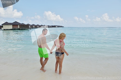 Image of happy young  couple at summer vacation have fun and relax
