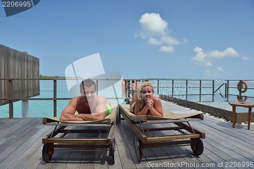 Image of happy young  couple at summer vacation have fun and relax