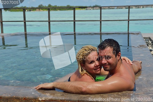 Image of happy young  couple at summer vacation have fun and relax
