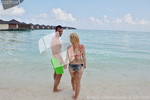 Image of happy young  couple at summer vacation have fun and relax