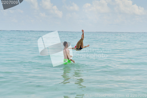 Image of happy young  couple at summer vacation have fun and relax