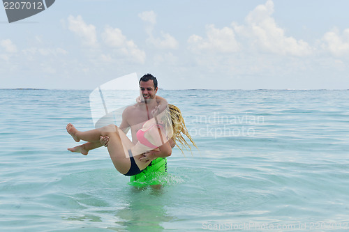 Image of happy young  couple at summer vacation have fun and relax