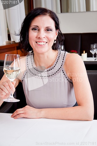 Image of happy smiling couple in restaurant celebrate