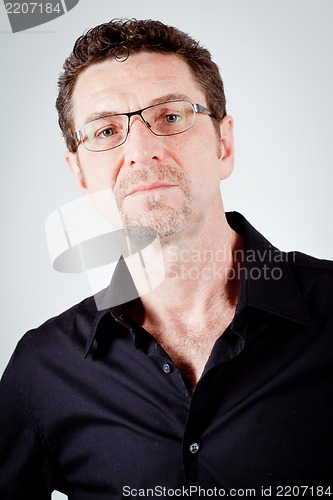 Image of attractive adult man with glasses and black shirt