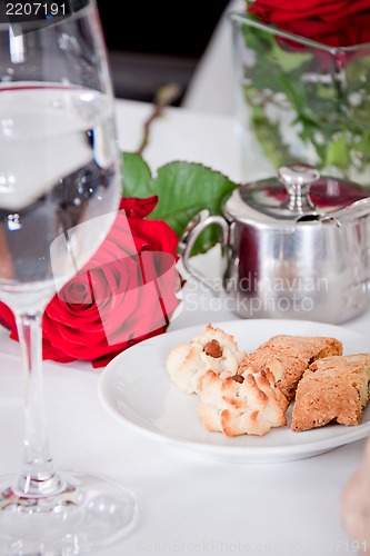 Image of waiter serve fresh espresso for happy couple 