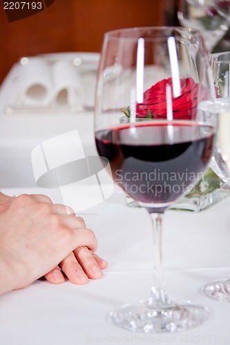 Image of happy smiling couple in restaurant celebrate