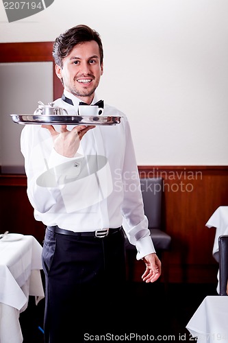 Image of waiter serve fresh espresso for happy couple 