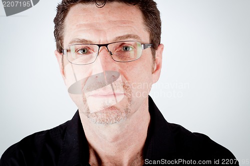 Image of attractive adult man with glasses and black shirt