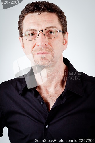 Image of attractive adult man with glasses and black shirt