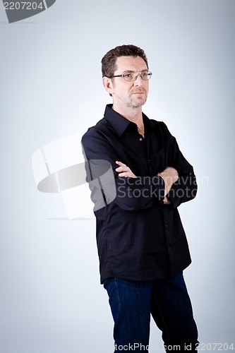 Image of attractive adult man with glasses and black shirt