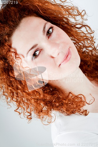 Image of attractive young redhead woman smiling portrait