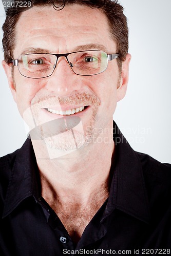 Image of attractive adult man with glasses and black shirt
