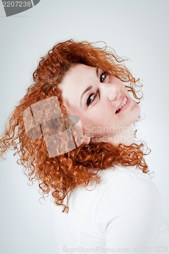 Image of attractive young redhead woman smiling portrait