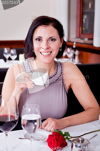 Image of waiter serve fresh espresso for happy couple 
