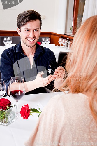 Image of happy couple in restaurant romantic date 