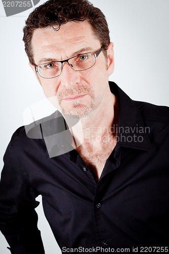 Image of attractive adult man with glasses and black shirt