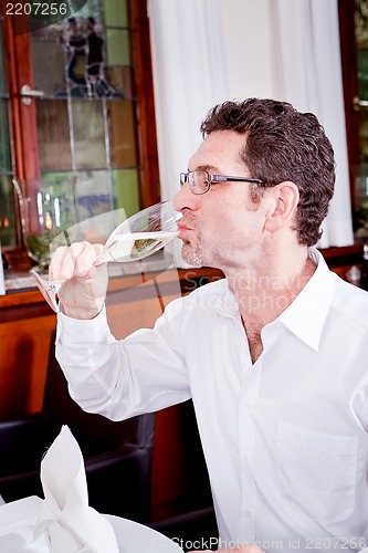 Image of happy smiling couple in restaurant celebrate