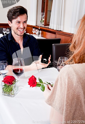 Image of happy couple in restaurant romantic date 