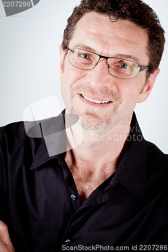 Image of attractive adult man with glasses and black shirt