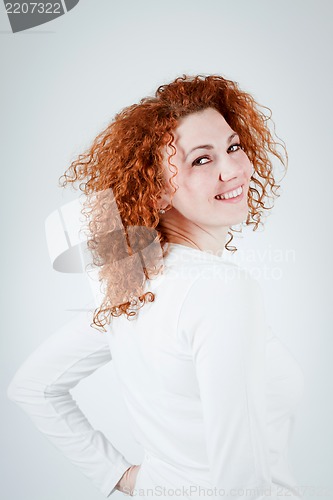 Image of attractive young redhead woman smiling portrait