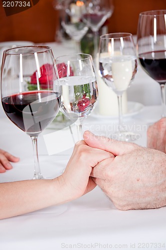 Image of happy smiling couple in restaurant celebrate