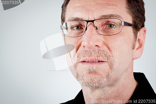 Image of attractive adult man with glasses and black shirt